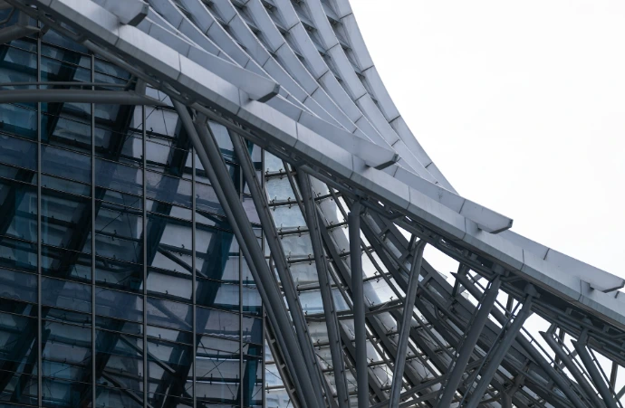a close up of a very tall building with a clock on it's side